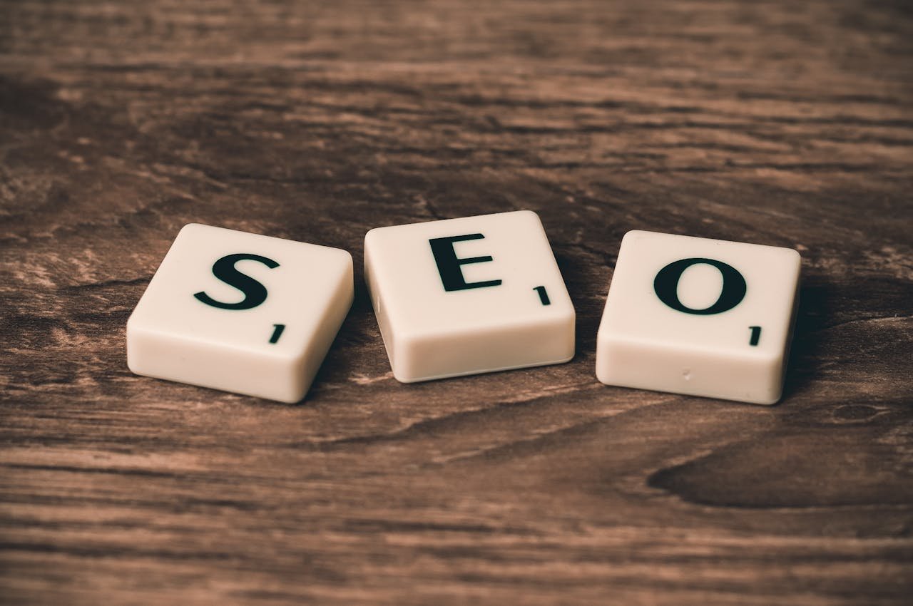 Crafting Captivating Headlines: Your awesome post title goes here Scrabble tiles spelling 'SEO' on a wooden surface. Ideal for digital marketing themes.